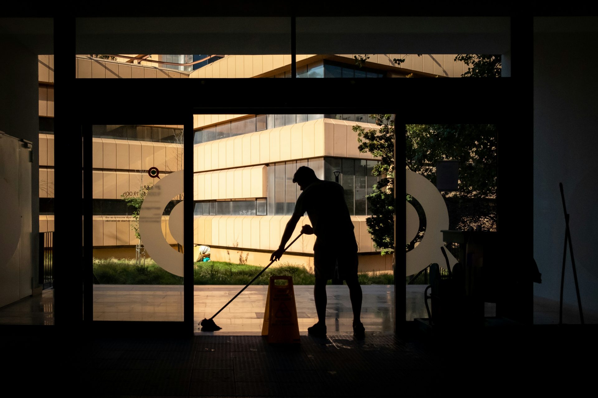 Person cleaning a public space