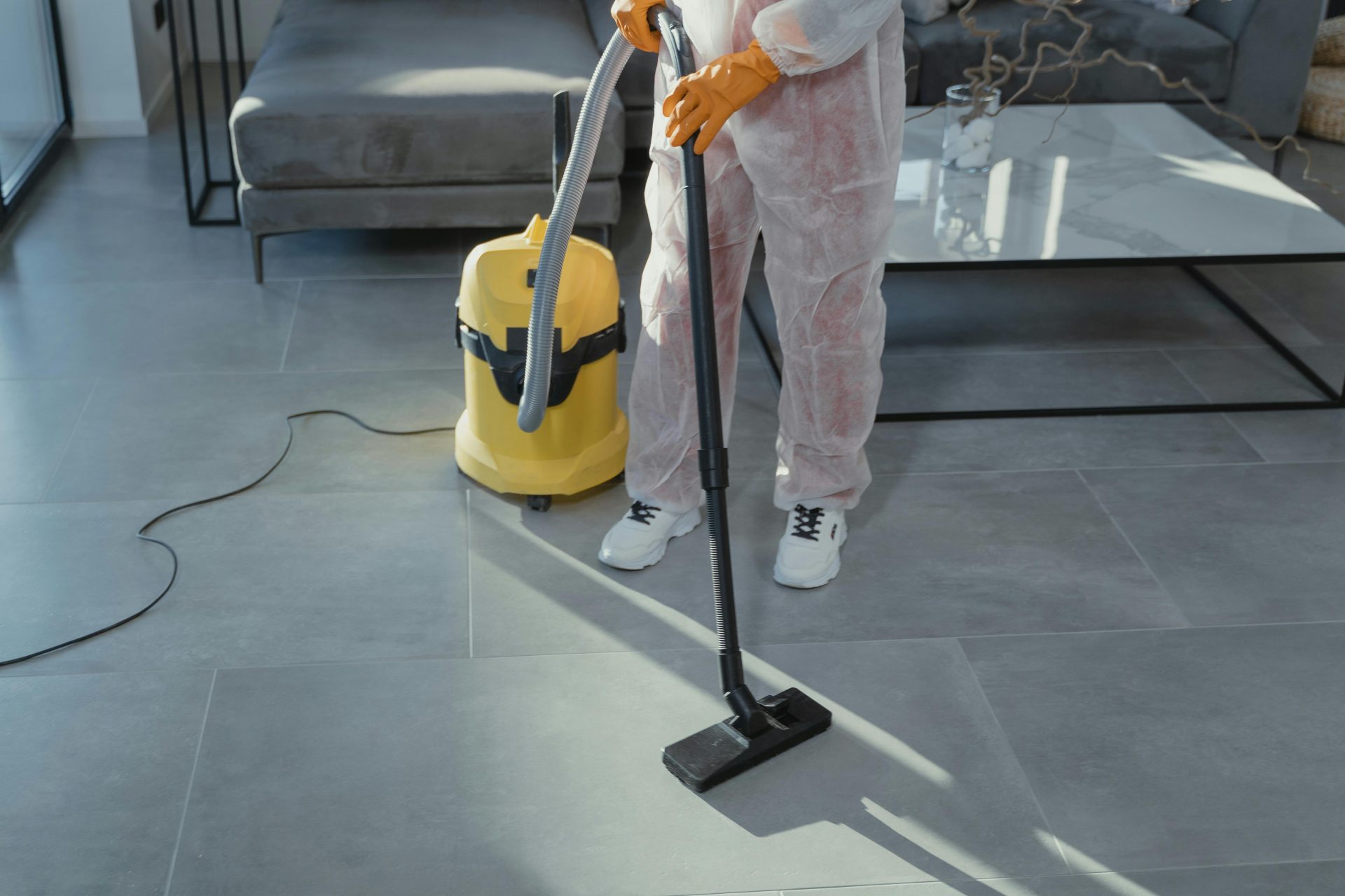 Man cleaning window with spray